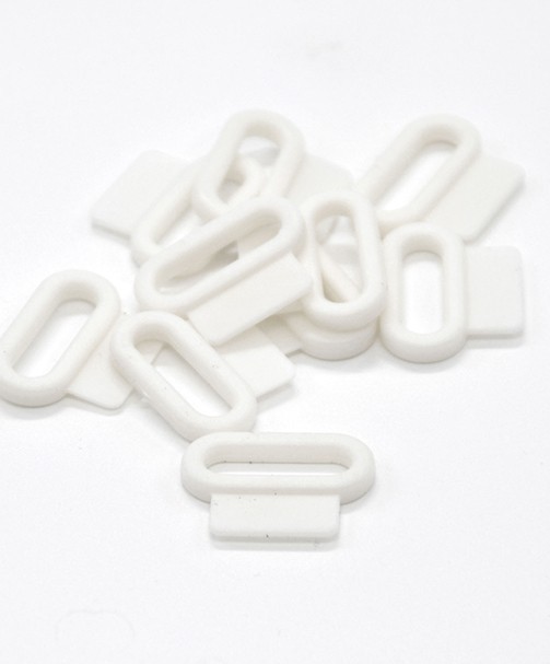 PASSANTS PLASTIQUES AVEC PATTE 20mm PASSANTS PLASTIQUES AVEC PATTE 20mm