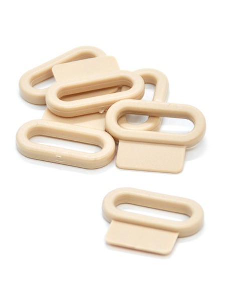 PASSANTS PLASTIQUES AVEC PATTE 25mm PASSANTS PLASTIQUES AVEC PATTE 25mm